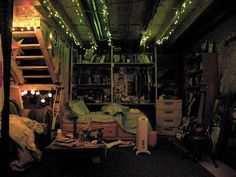 a room with lots of furniture and lights on the ceiling, in front of a bookshelf