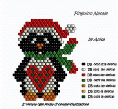 a cross stitch penguin with a christmas hat and scarf