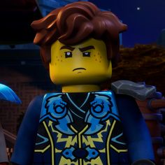 the lego movie character is holding an umbrella