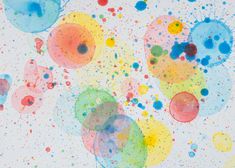 an abstract painting with multicolored circles and dots on the bottom half of it