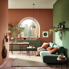 a living room filled with furniture next to a large window and potted plants on the wall