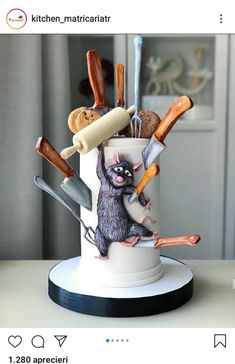 a cake decorated to look like an animal holding knives