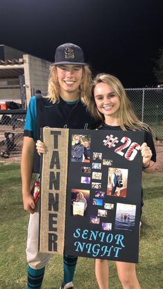 two people standing in the grass holding a sign that says senior night with pictures on it