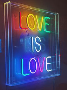 a neon sign that says love is love