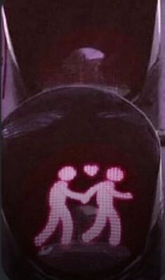 a close up of a traffic light with a sticker on it