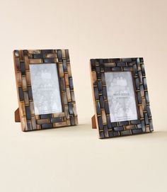 two wooden frames sitting next to each other