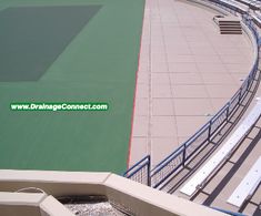 an aerial view of a tennis court from the top of a building with stairs leading up to it