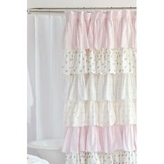 a shower curtain with pink and white ruffles