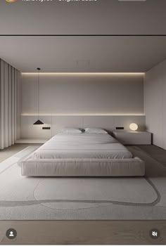 a large white bed sitting in a bedroom next to a wall mounted light above it