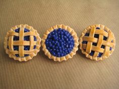 three miniature pies sitting on top of a table