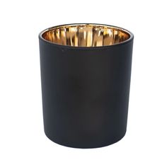 a black candle holder with gold rims