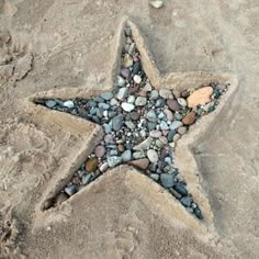 a starfish made out of rocks and stones on the beach with text reading summer - vibezz follow