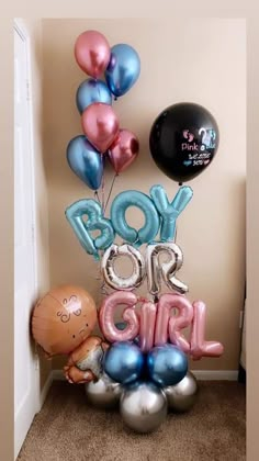 balloons and heliums in the shape of letters spelling out boy and girl