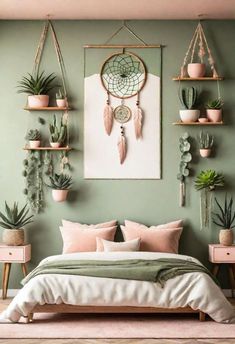 a bedroom with green walls and plants hanging on the wall above the bed, along with potted cacti