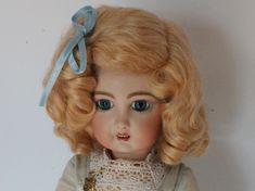 The Daisy style wig is the classic German wig found on the popular Kestner 171 Daisy doll and many other German dolls. This wig has a side part with bangs pulled back in a bow with two staggered rows of soft ringlet curls surrounding the head. Made of the finest quality mohair. The colors resemble those of the original antique dolls. This wig is sure to enhance the beauty of your antique doll when only the best will do Bangs Pulled Back, Side Part With Bangs, Pull Back Bangs, Ringlet Curls, Style Wig, Doll Wig, German Dolls, Doll Wigs, Creepy Dolls