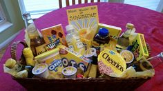 a basket filled with condiments on top of a pink tablecloth covered table