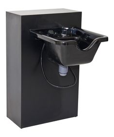 a black box with a water fountain in it