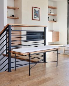 a living room filled with furniture and a fire place next to a wall mounted oven