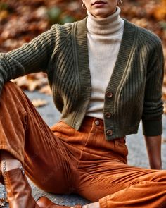 Effortlessly Polished Fall Outfit: Olive Cardigan, Beige Turtleneck, and Burnt Orange High-Waisted Corduroys Stock Photo Burnt Orange And Olive Green Outfit, Burnt Orange Turtleneck Outfit, Orange And Burgundy Outfits, Burnt Orange Corduroy Pants Outfit, Cardigan And Turtleneck Outfit, Turtleneck And Cardigan Outfit, Burnt Orange Top Outfit