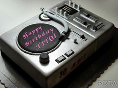 a birthday cake that is shaped like a tape recorder