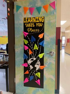 a classroom door decorated with colorful kites and the words learning takes you places