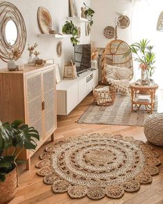 a living room filled with lots of furniture and decor on top of wooden flooring