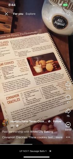 the recipe book is open and ready to be used on the table with other items