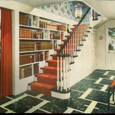 a room with stairs and bookshelves in it