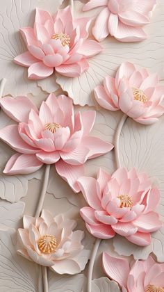 some pink flowers and leaves on a white surface