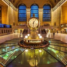 a clock in the middle of a large building