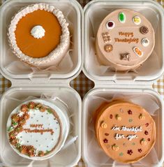 four plastic trays filled with different types of cakes