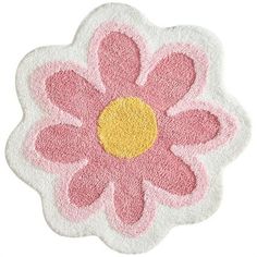 a pink and yellow flower shaped rug