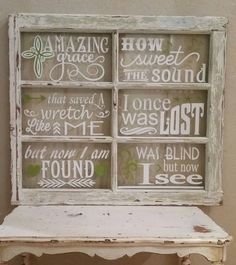 an old window is decorated with words and sayings on the windowsill, as well as a bench