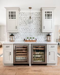 a kitchen with two wine coolers in it