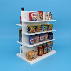 an assortment of canned food items displayed on three tiered shelving unit against a blue background