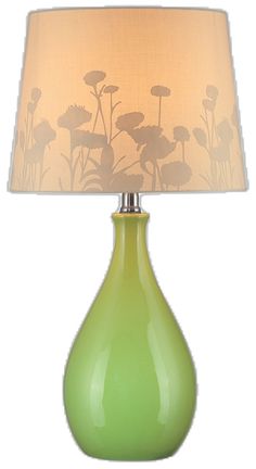 a green vase lamp with a shade on it's face and flowers drawn on the lampshade