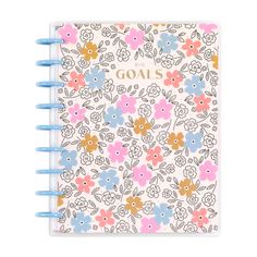 a spiral notebook with flowers and the words goals written on it in gold foil lettering