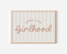 a framed sign that says, long live girlhood