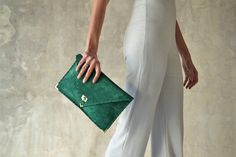 "The perfect bag for all day needs, evening entertainment and going to a party. This adorable bag is handmade out of a beautiful high quality, emerald green suede Italian leather. It is hand stitched with green waxed thread. The color of the waxed thread can change upon request. The interior is fully lined with beige leatherette. The clutch closes with a metal twisted clasp and has metal endings, available in silver and gold color. The pictures show the clutch with gold metal hardware. Dimension Everyday Green Clutch, Green Leather Clutch For Evening, Green Leather Evening Clutch, Chic Green Leather Clutch, Chic Green Pouch Evening Bag, Chic Green Clutch Evening Bag, Chic Green Clutch For Everyday, Elegant Green Envelope Clutch, Green Envelope Clutch For Everyday Use