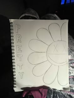 a child's drawing of a flower on a piece of paper