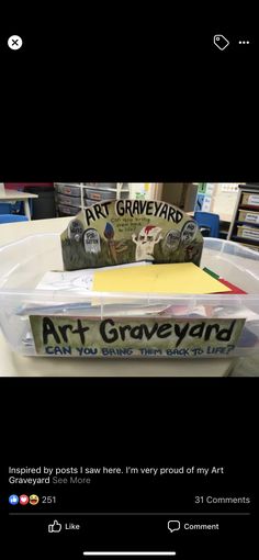 a plastic container filled with art and craft supplies sitting on top of a table next to a book shelf