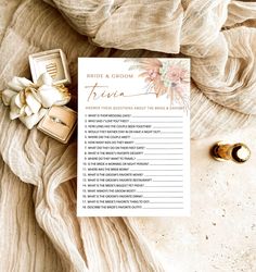 a bridal and groom advice card next to two wedding rings on top of a blanket