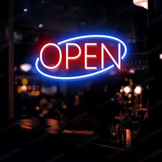 an open sign lit up in the dark