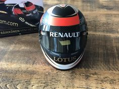 a helmet sitting on top of a wooden table