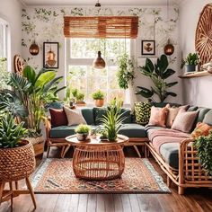 a living room filled with lots of plants