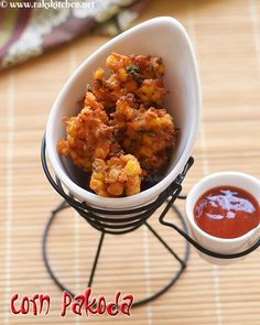 a small white bowl filled with food next to sauce