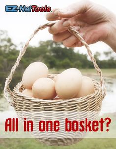 a person holding a basket with eggs in it and the words, all in one basket?