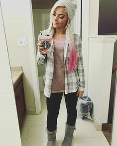 a woman with pink hair is taking a selfie in the mirror while holding a cell phone