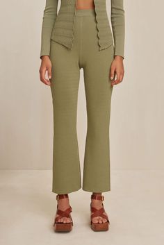 A high-waisted, cropped pant with flared leg and a flat elastic waistband. - Flared leg- High-waist- Elastic waistband- Pairs with the Troi Knit Top Flare Bottoms With Elastic Waistband For Loungewear, Chic Flare Bottoms For Loungewear, Flare Bottoms For Fall Loungewear, Chic Flare Pants For Loungewear, Chic Green Cropped Leg Bottoms, Chic Green Cropped Bottoms, Green Bottoms With Ribbed Waistband For Fall, Chic Cropped Leg Loungewear Pants, Chic Cropped Leg Lounge Pants