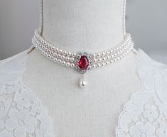 Ruby CZ Bridal Choker, Vintage Style Ruby Necklace, Wedding Pearl and Ruby CZ Bridal Choker, Ruby Victorian  Vintage Chocker Materials used: - White/Ivory Cream Swarovski pearls - cubic zirconia stones - rhodium plated over brass The necklace will arrive packaged ready for gift giving in a delicate white jewelry box with a silver ribbon. Back to my shop http://www.etsy.com/shop/crinadesign73 Thank you for visiting my store! Ruby Bridal Jewelry, Ruby Pearl Necklace, Vintage Ruby Necklace, Pearl And Ruby Necklace, Silver Ruby Necklace, Ruby And Pearl Necklace, Vintage Necklace Victorian, Ruby Choker Necklace, Ruby Jewelry Set